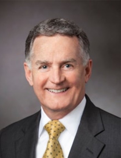 Male employee smiles for camera
